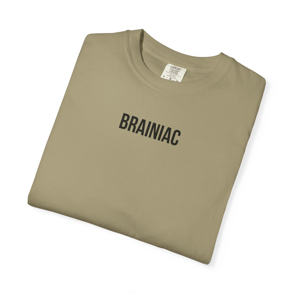 Folded khaki t-shirt with 'BRAINIAC' text on a white background