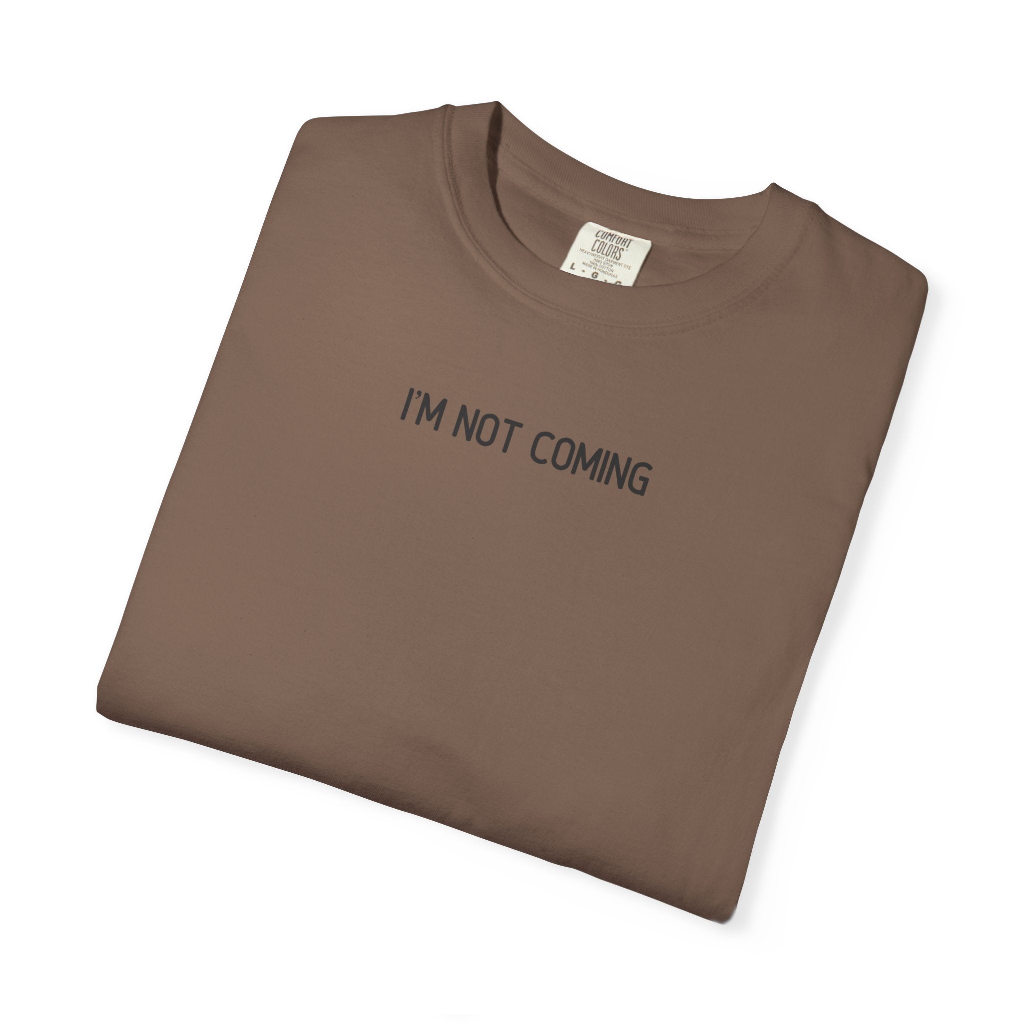 Folded brown t-shirt with 'I'M NOT COMING' text on a white background