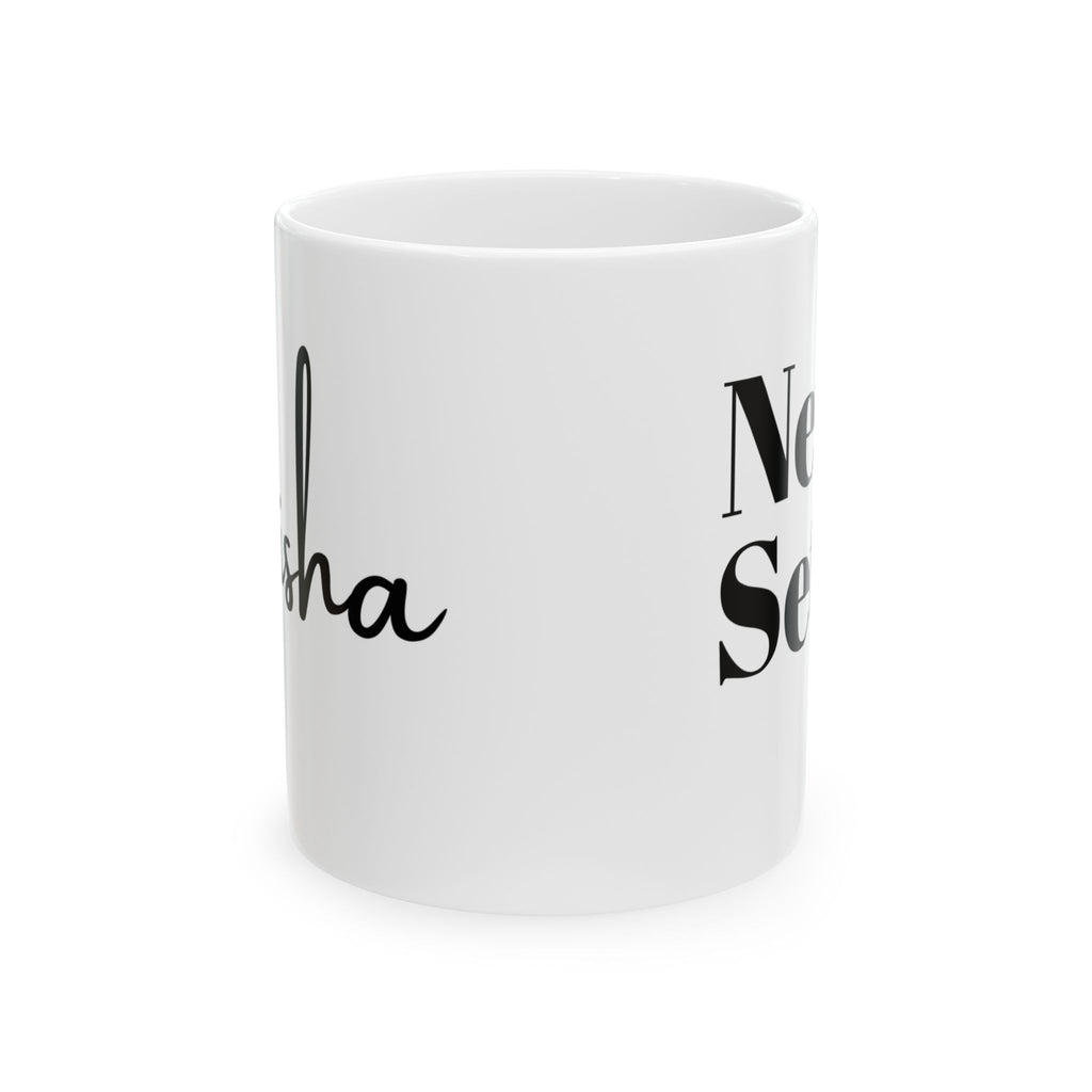 White mug with black text on a white background