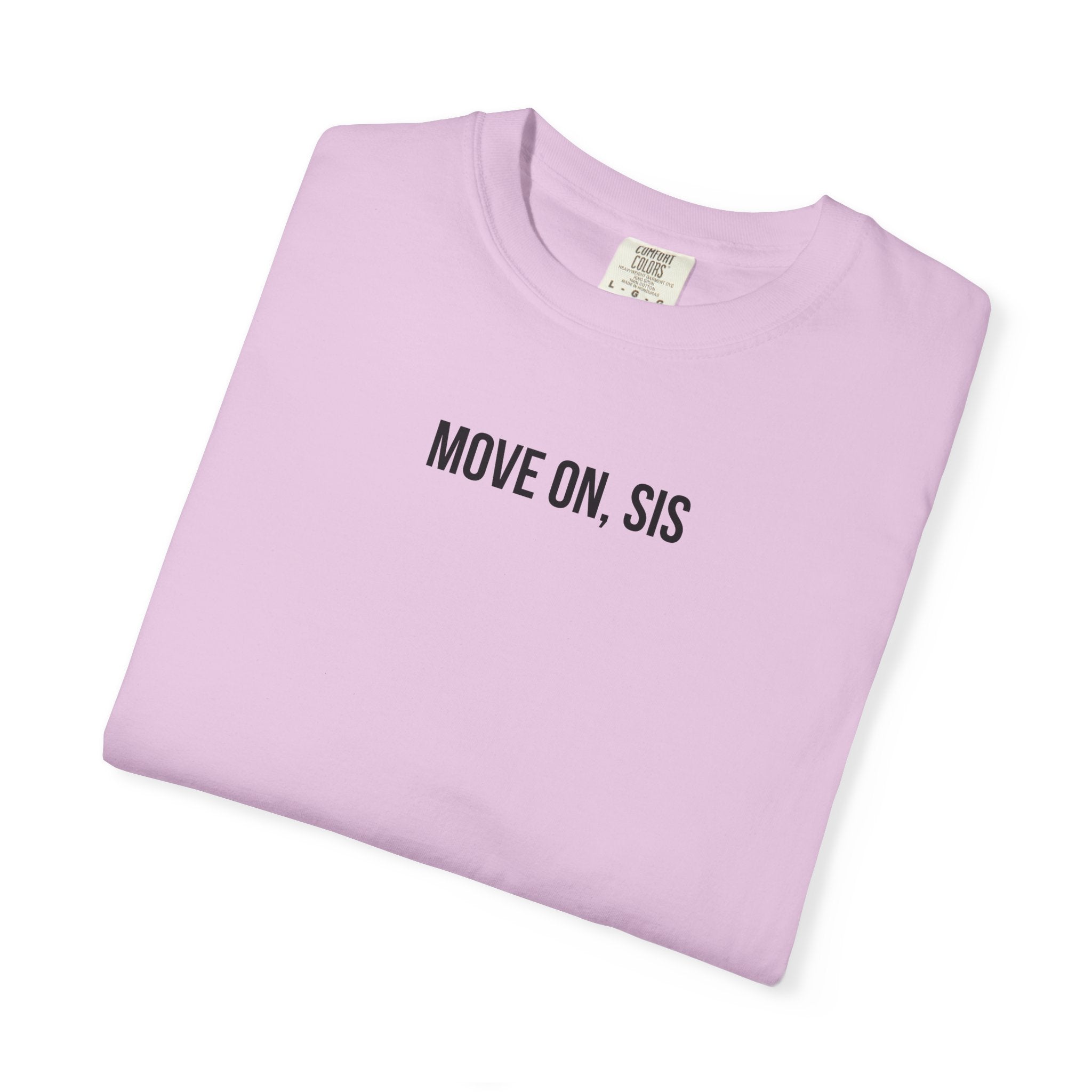 Folded light purple t-shirt with 'MOVE ON, SIS' text on a white background